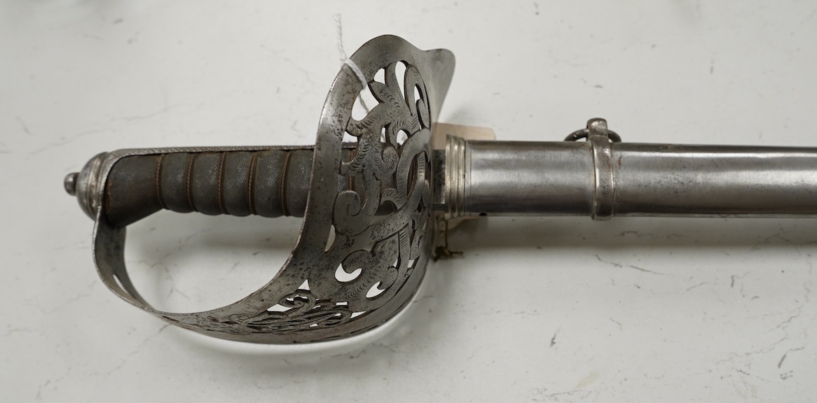 An 1895 pattern late Victorian infantry officer’s sword in its steel scabbard, made by E. Thurkle, 5 Denmark St. Soho, blade 83cm. Condition - good, however scabbard heavily cleaned